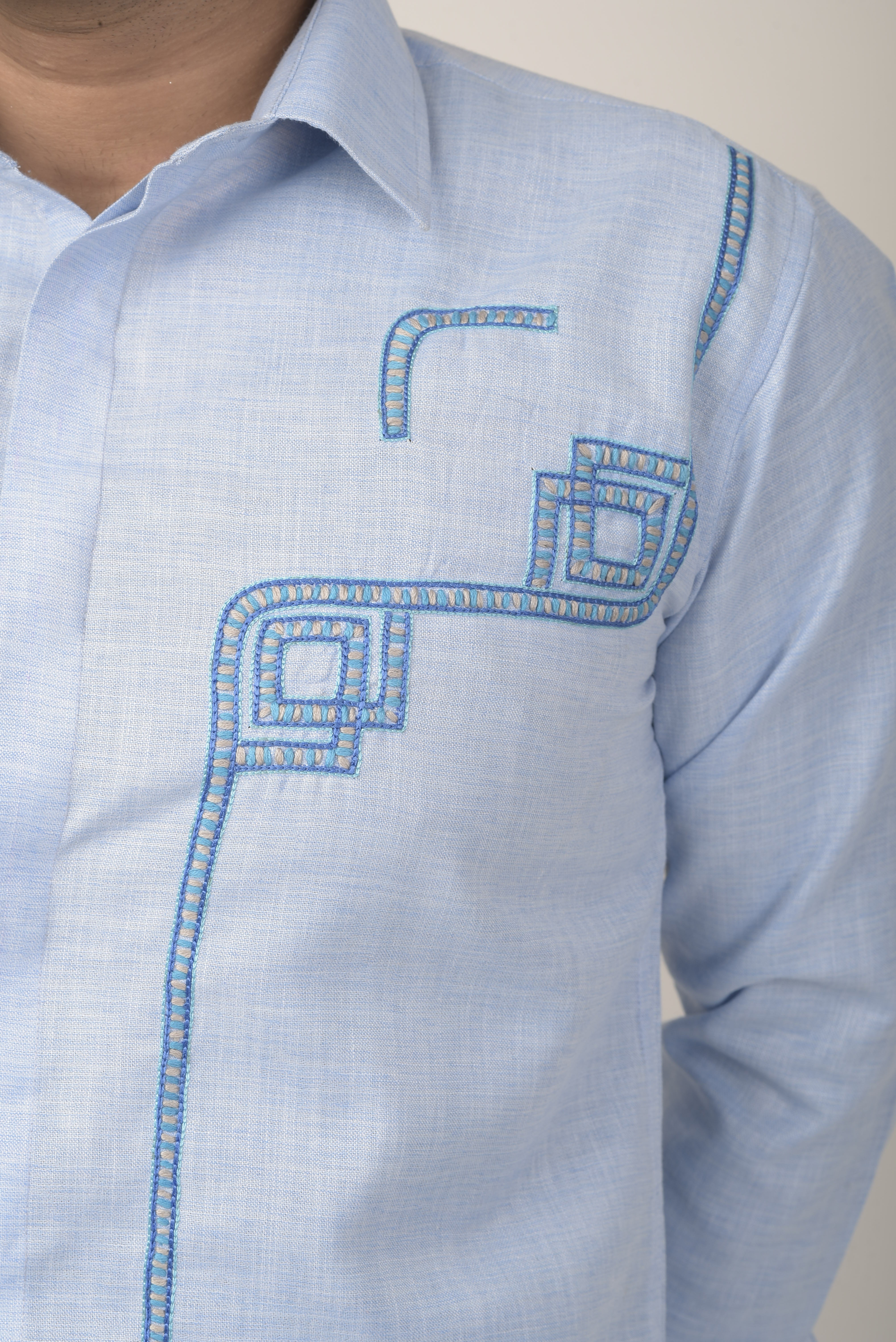 light blue long-sleeve shirt with a subtle textured fabric