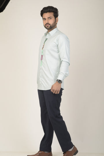 Mint green base shirt with a micro-patterned texture